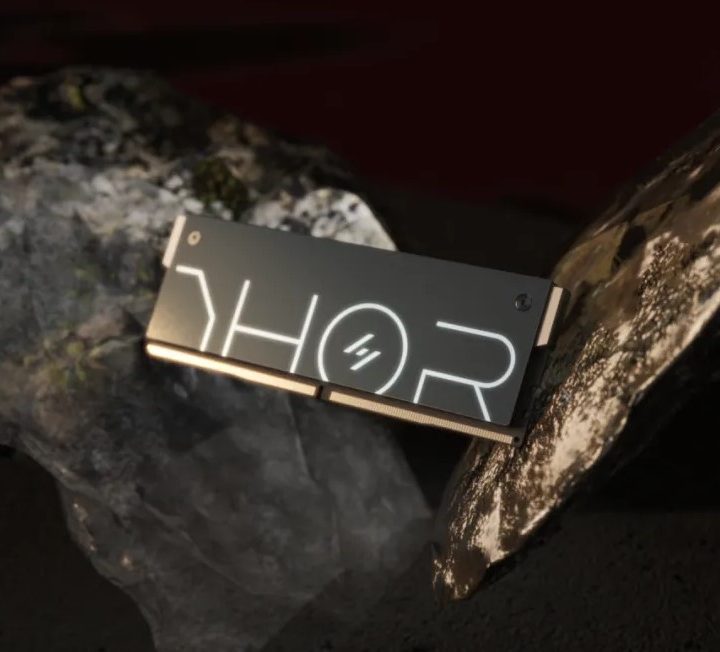 An Asgard THOR RAM stick in front of a rock.
