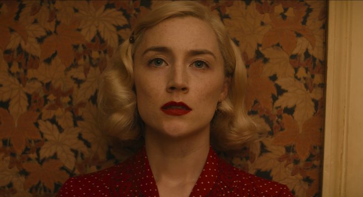 A concerned Saoirse Ronan looks on.