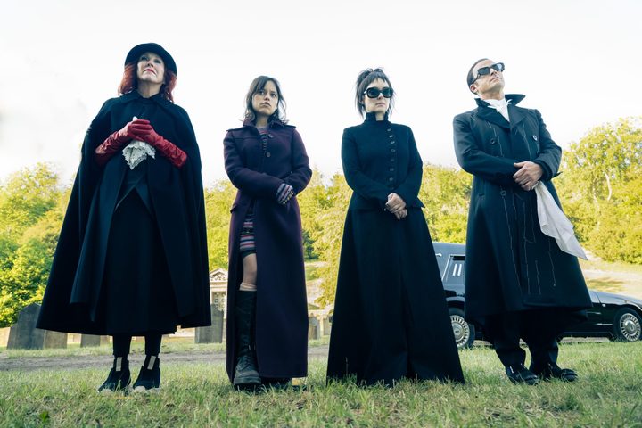 Catherine O'Hara, Jenna Ortega, Winona Ryder, and Justin Theroux stand in a cemetery in Beetlejuice Beetlejuice.