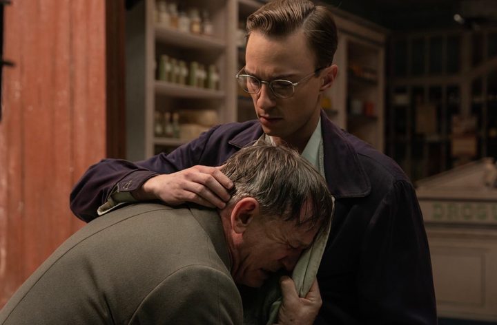 A man holds another man in Queer.