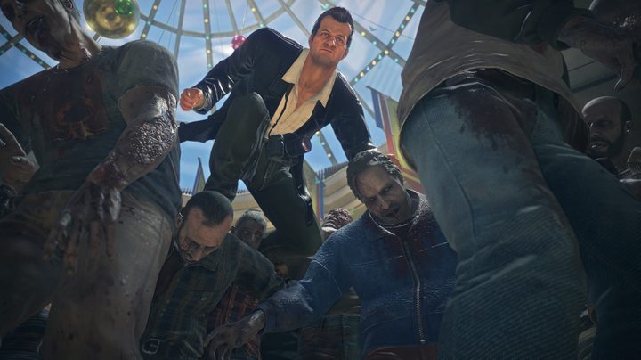 Frank West leaps over zombies in Dead Rising Deluxe Remaster.