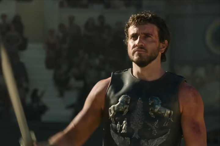 Paul Mescal wields a sword and stares.