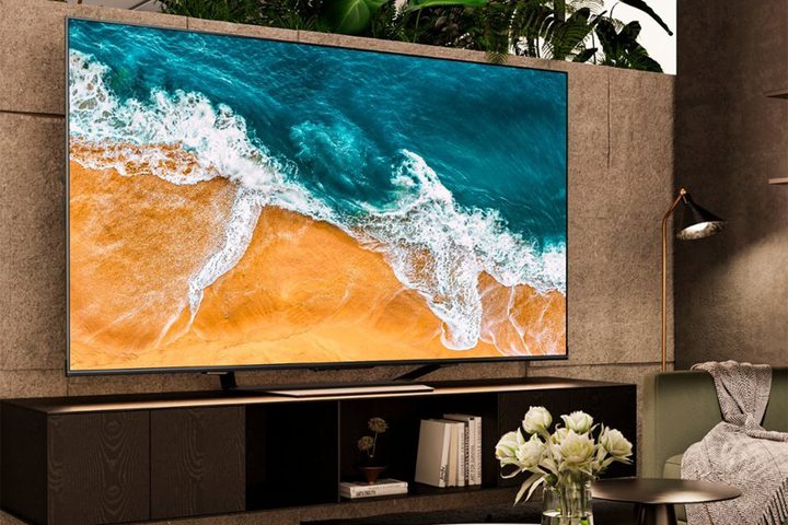 The Hisense 85-inch U7 Mini-LED QLED TV on a TV unit in a living room.