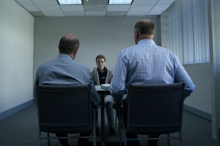 Kaitlyn Dever sits across from two police detectives in Unbelievable.