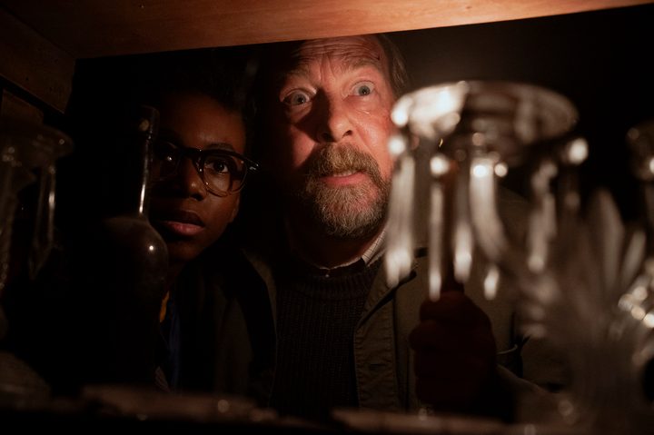 Mike and Matt peer through a shelf in Salem's Lot.