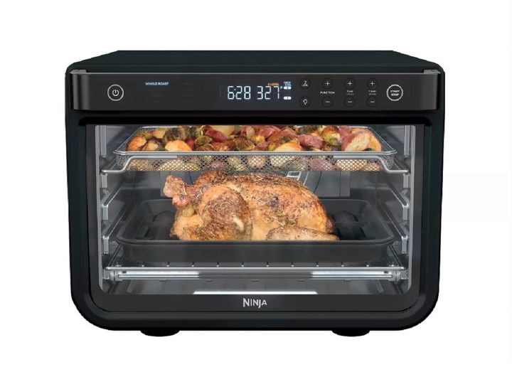 The Ninja Food XL Pro Air Fry Oven cooking food.