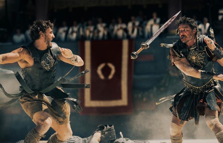 Paul Mescal and Pedro Pascal throw swords.
