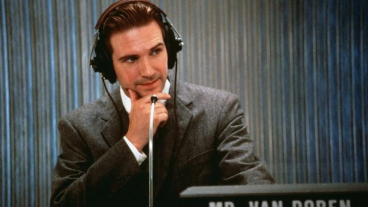 Ralph Fiennes as Charles Van Doren looking pensive with his hand on his chin in Quiz Show.
