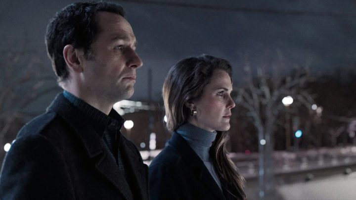 Matthew Rhys and Keri Russell standing next to each other in The Americans.
