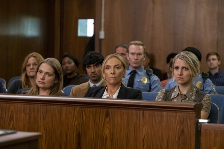 Toni Collette and Merritt Wever sit in a courtroom in Unbelievable.