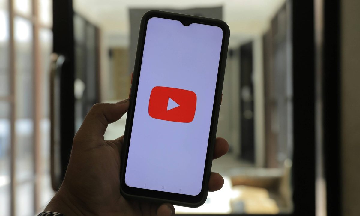 A YouTube logo on a phone screen