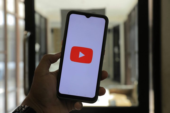A YouTube logo on a phone screen
