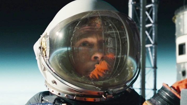 An astronaut looks up at the stars in Ad Astra.