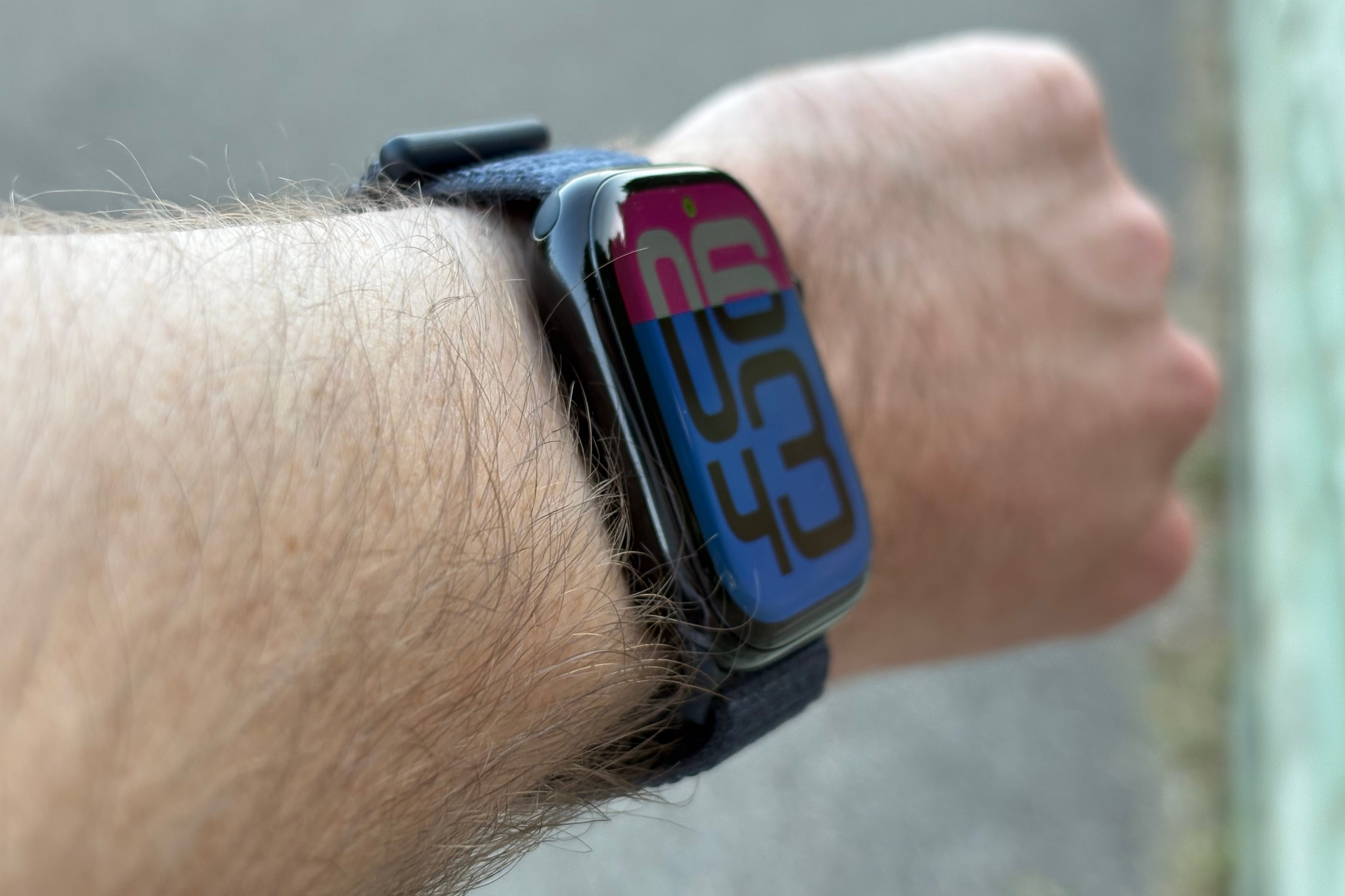 The Apple Watch Series 10, viewed at an angle from someone's wrist.