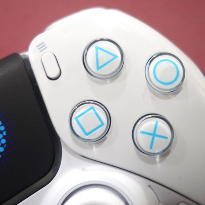 A close up look at the Astro Bot controller's face buttons.