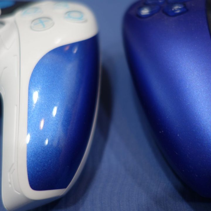 The color of an Astro Bot DualSense controller compared to another blue PS5 controller.