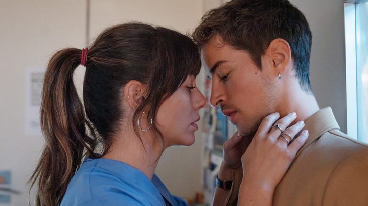 A man and a woman almost kiss in Breathless.