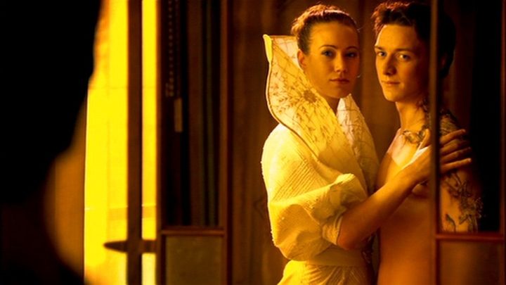 A man and a woman embrace in Children of Dune.