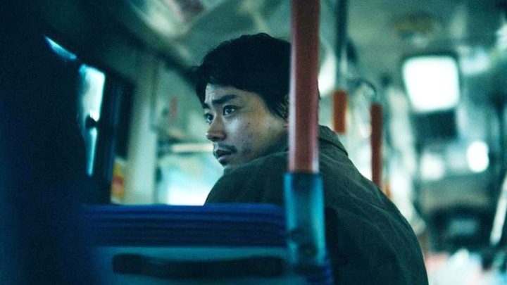 A man rides a bus in Cloud.