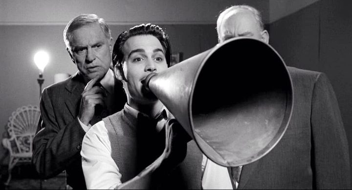 A man speaks through a bullhorn in Ed Wood.