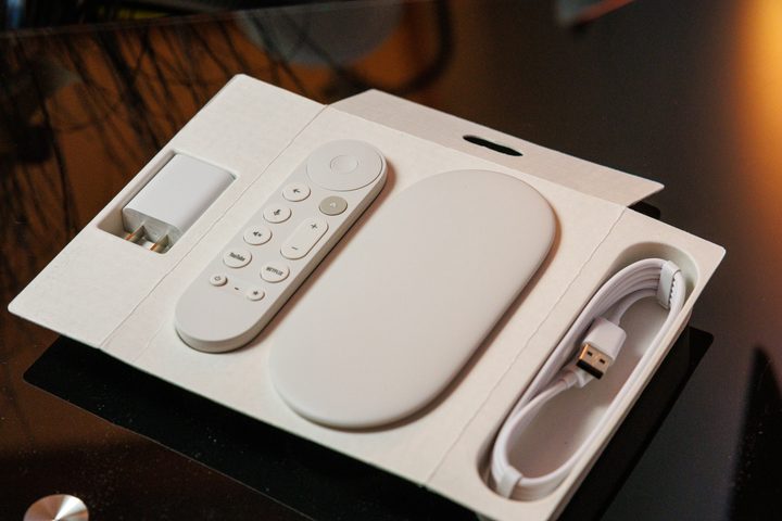 Google TV Streamer with the remote control and cables in its retail box.