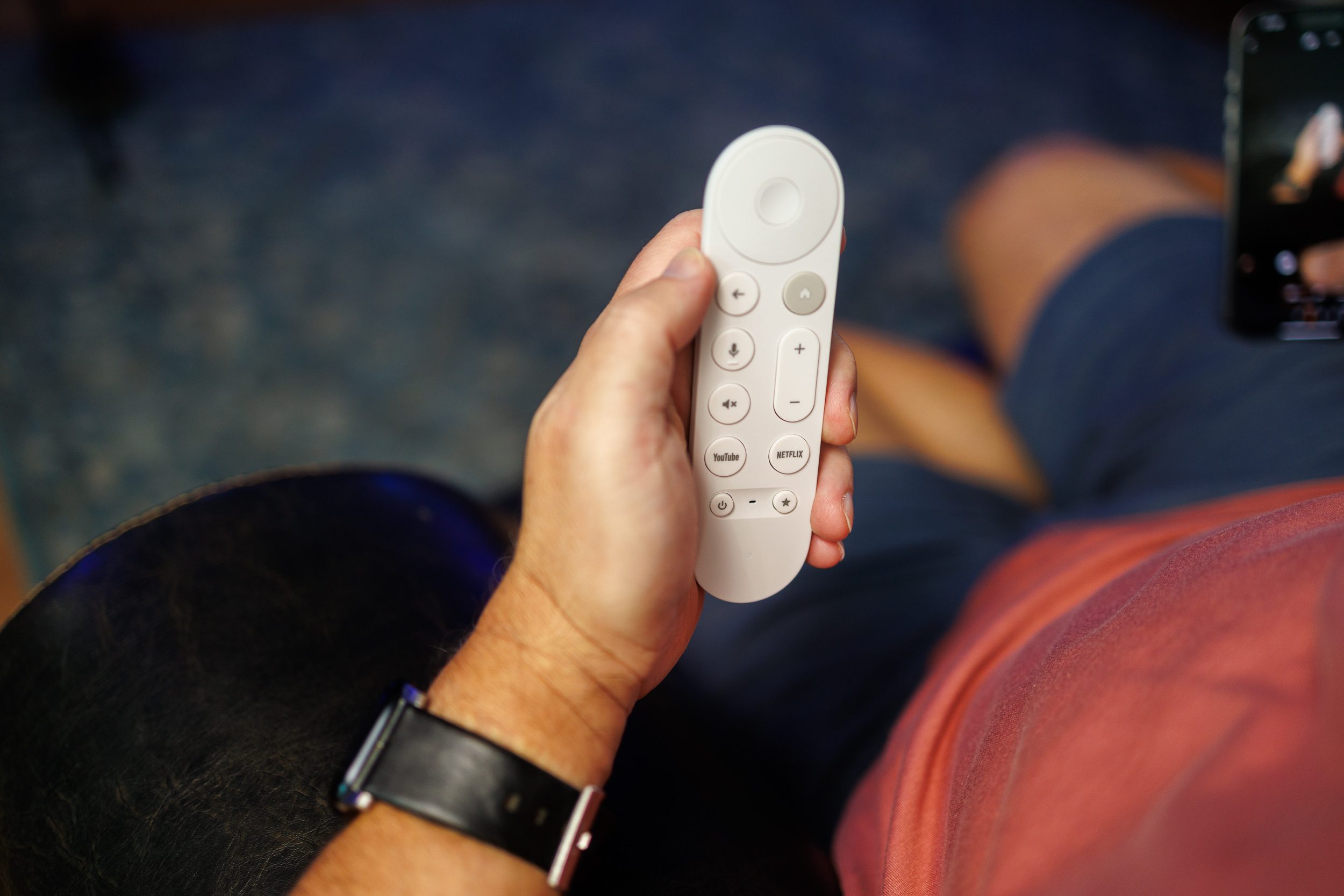 The Google TV Streamer remote control in a very good-looking hand.