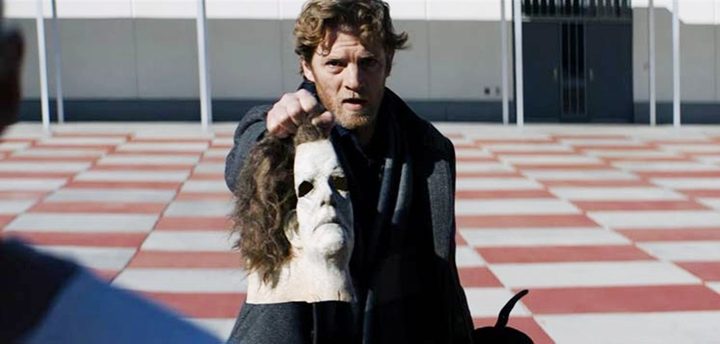 A man holds a mask in Halloween.
