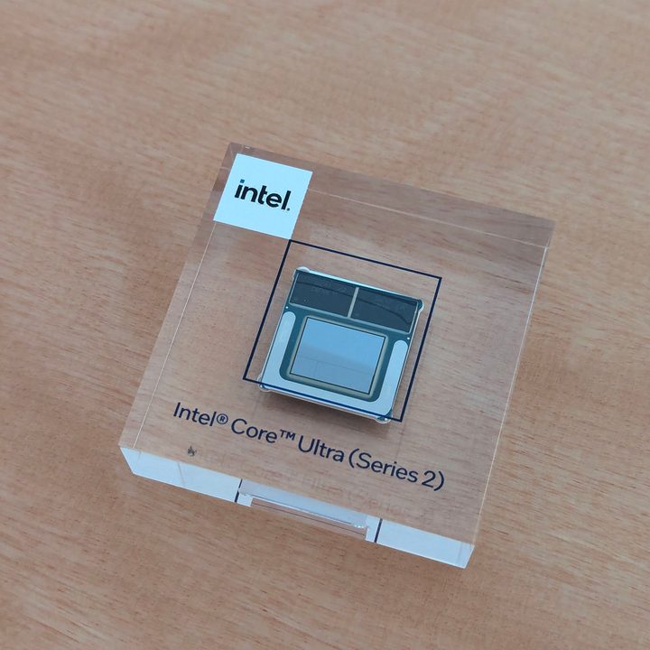 An Intel Core Ultra Series 2 chip embedded in a piece of glass.