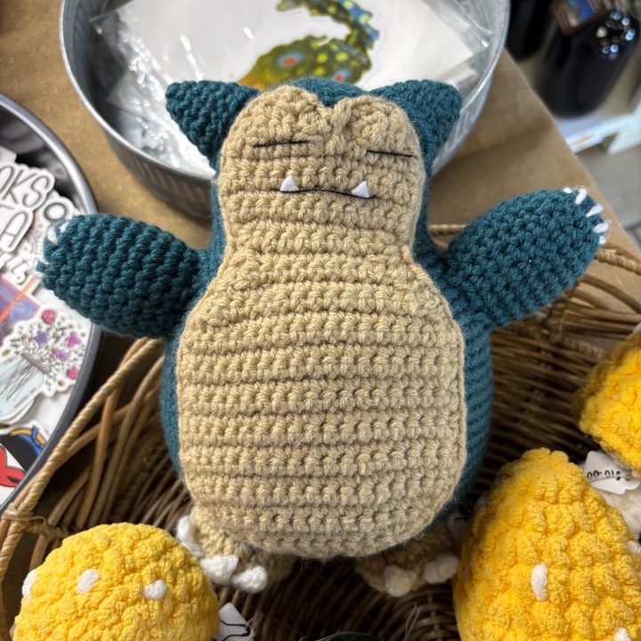 A photo of a knitted Pokemon, taken with the iPhone 16.