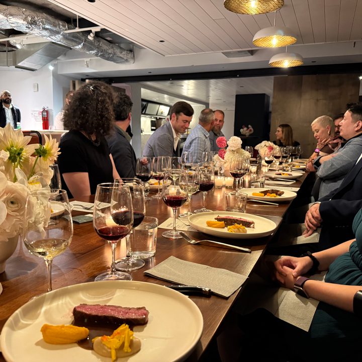A photo of a long formal dining table, taken with the iPhone 16 Pro.