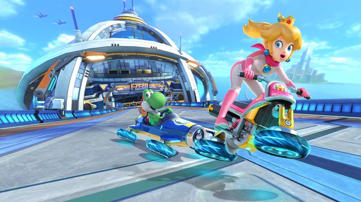 Mario Kart 8 Deluxe's Peach and Yoshi on hovering racer vehicles looking at the camera.
