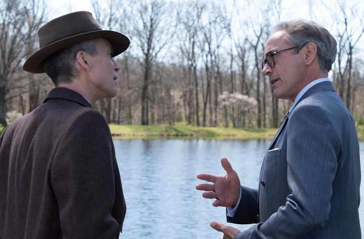 Two men talk in Oppenheimer.