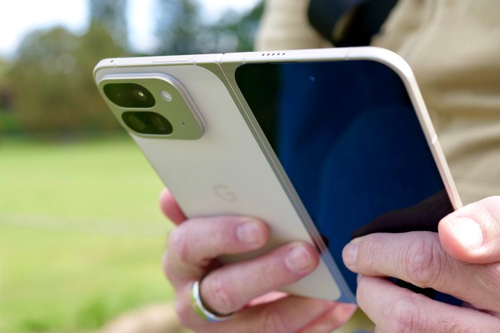 A person holding the open Google Pixel 9 Pro Fold.