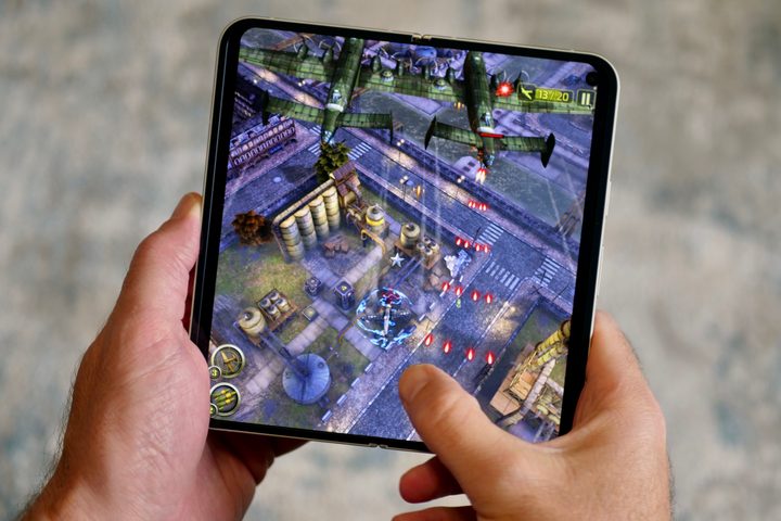 A person playing a game on the Google Pixel 9 Pro Fold.