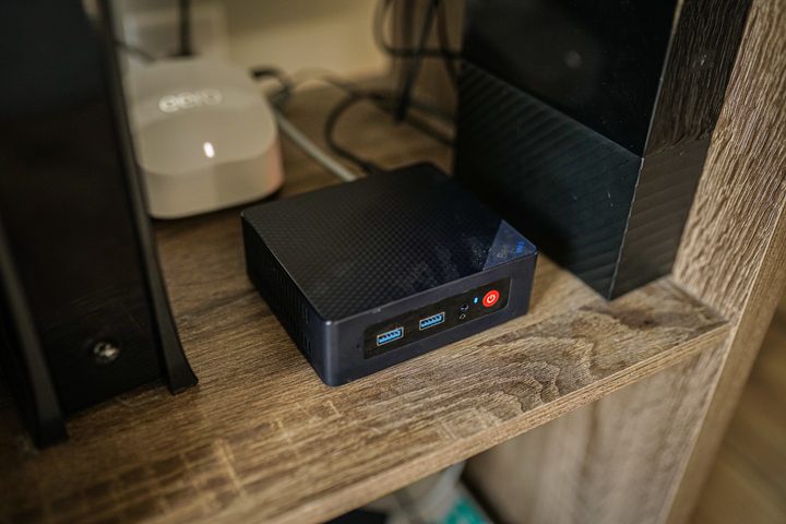 A mini PC connected to a network router.