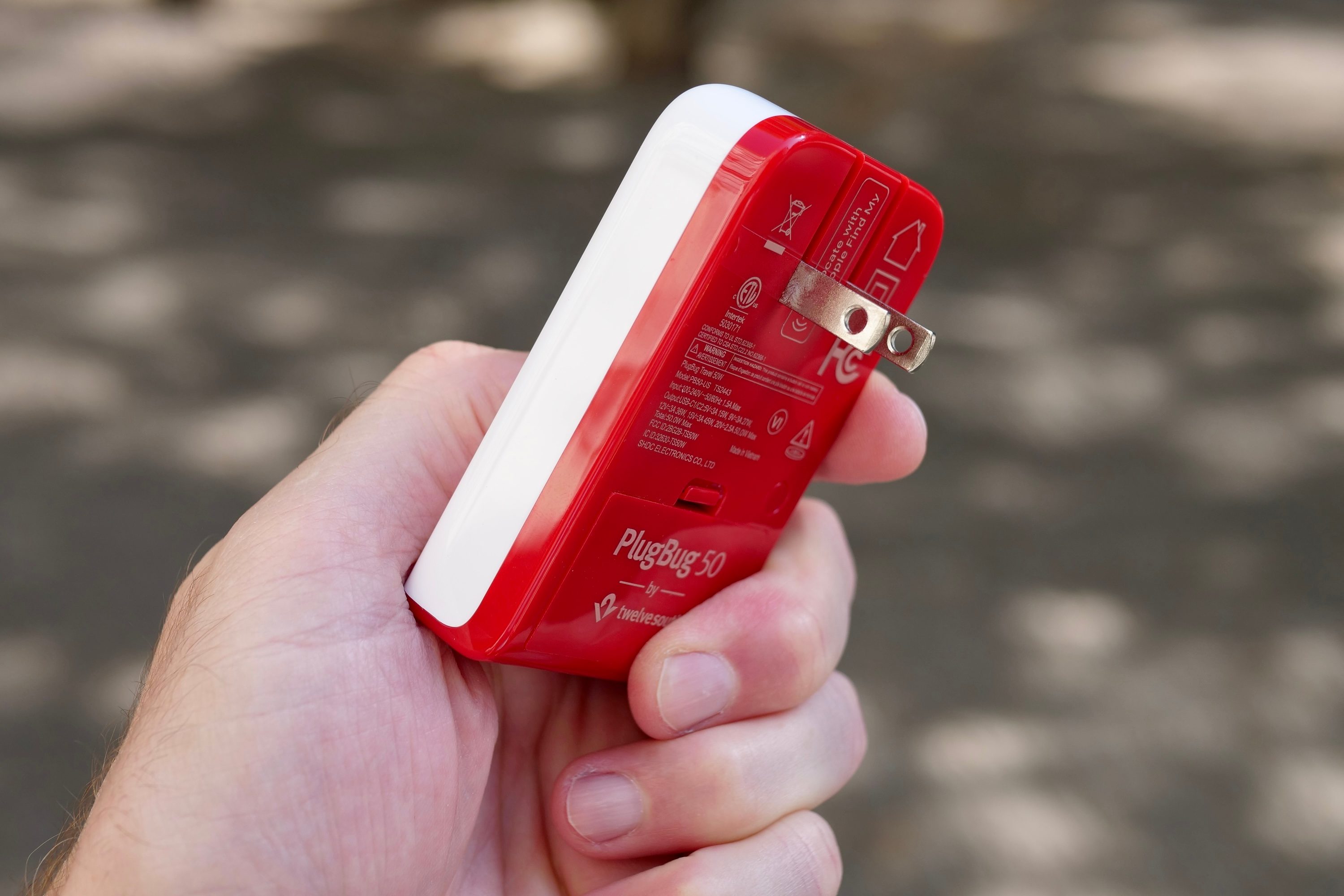 A person holding the PlugBug charger.