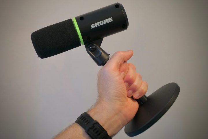 A person holding the Shure MV6 microphone.