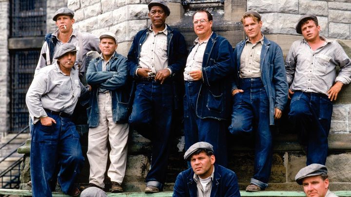 A group of prisoners pose for a picture in The Shawshank Redemption.