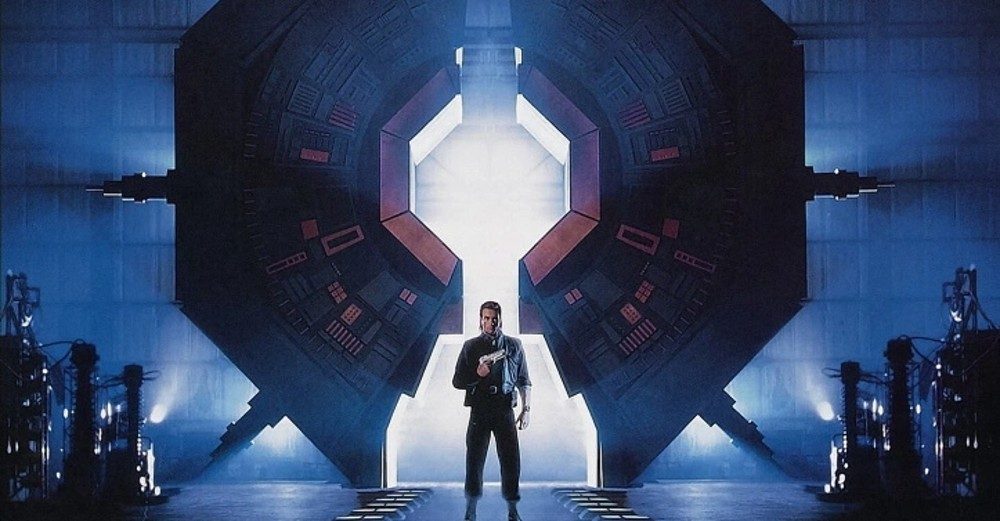 A man stands in front of a massive machine in Timecop.