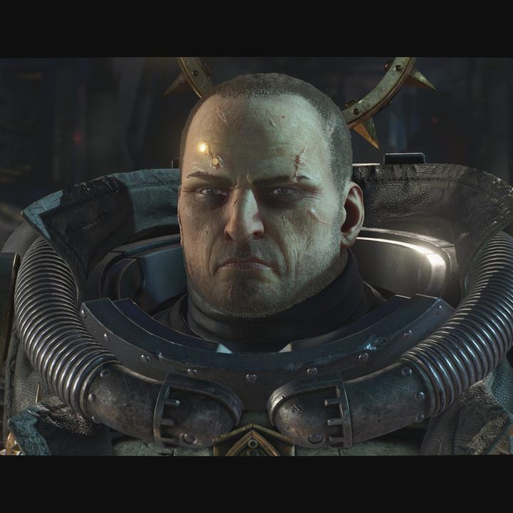 The image shows the Chaplain without his helmet. He's revealed to be Leandros, Titus' rival from the first game.