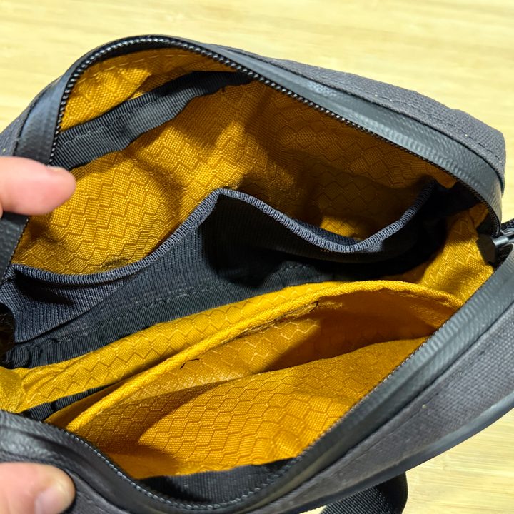 Waterfield Designs Shinjuku Sling in black, showing what it looks like inside when empty.