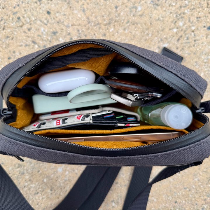 Waterfield Designs Shinjuku Sling in black, showing what it looks like inside when full.