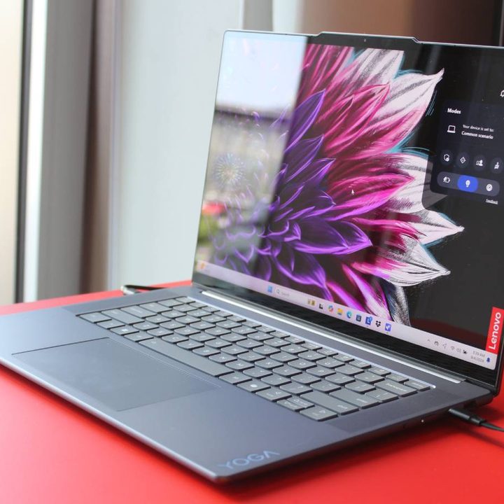 A Yoga Slim 7i on a red table.