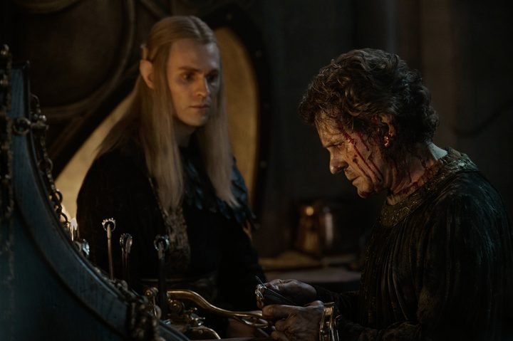 A bloodied Celebrimbor sits near Sauron in The Lord of the Rings: The Rings of Power season 2.