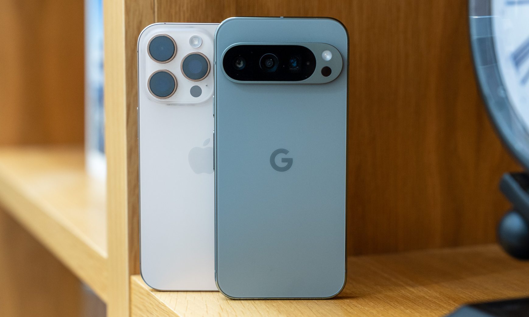 Hero photo of the back of the iPhone 16 Pro and Pixel 9 Pro
