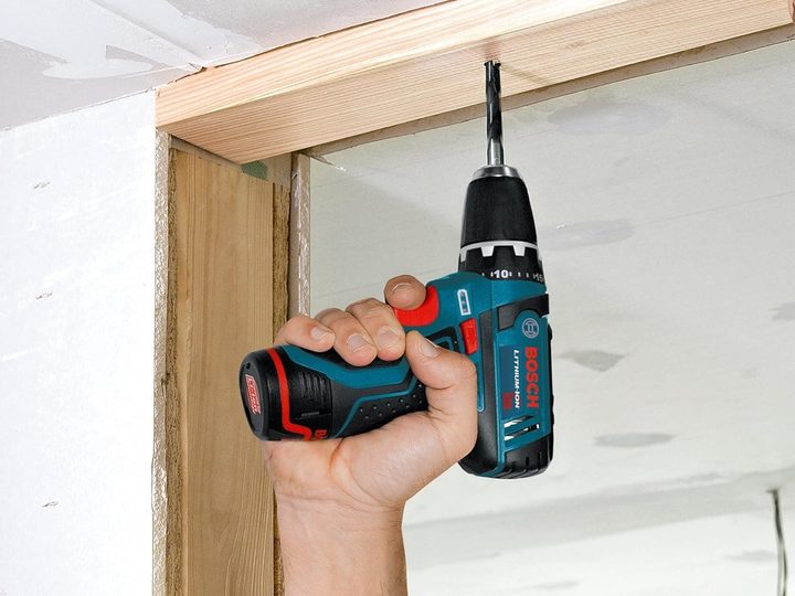 Drilling into an overhead 2x4 with the Bosch PS31 cordless drill.