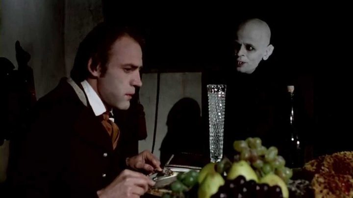 Bruno Ganz and Klaus Kinski as Jonathan Harker and Count Dracula at the dinner table in Nosferatu the Vampyre.