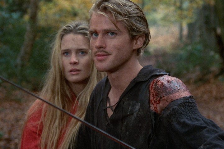 Cary Elwes stands in front of Robin Wright in The Princess Bride.
