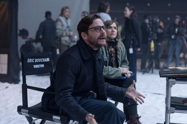 Daniel Bruhl sits in a director's chair in The Franchise.