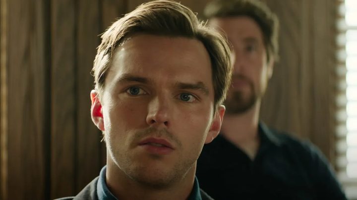 Nicholas Hoult stares in close-up with simmering unease in a still from the movie Juror #2.